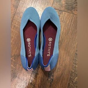 Rothy’s. Discontinued blue with red stripe on the back